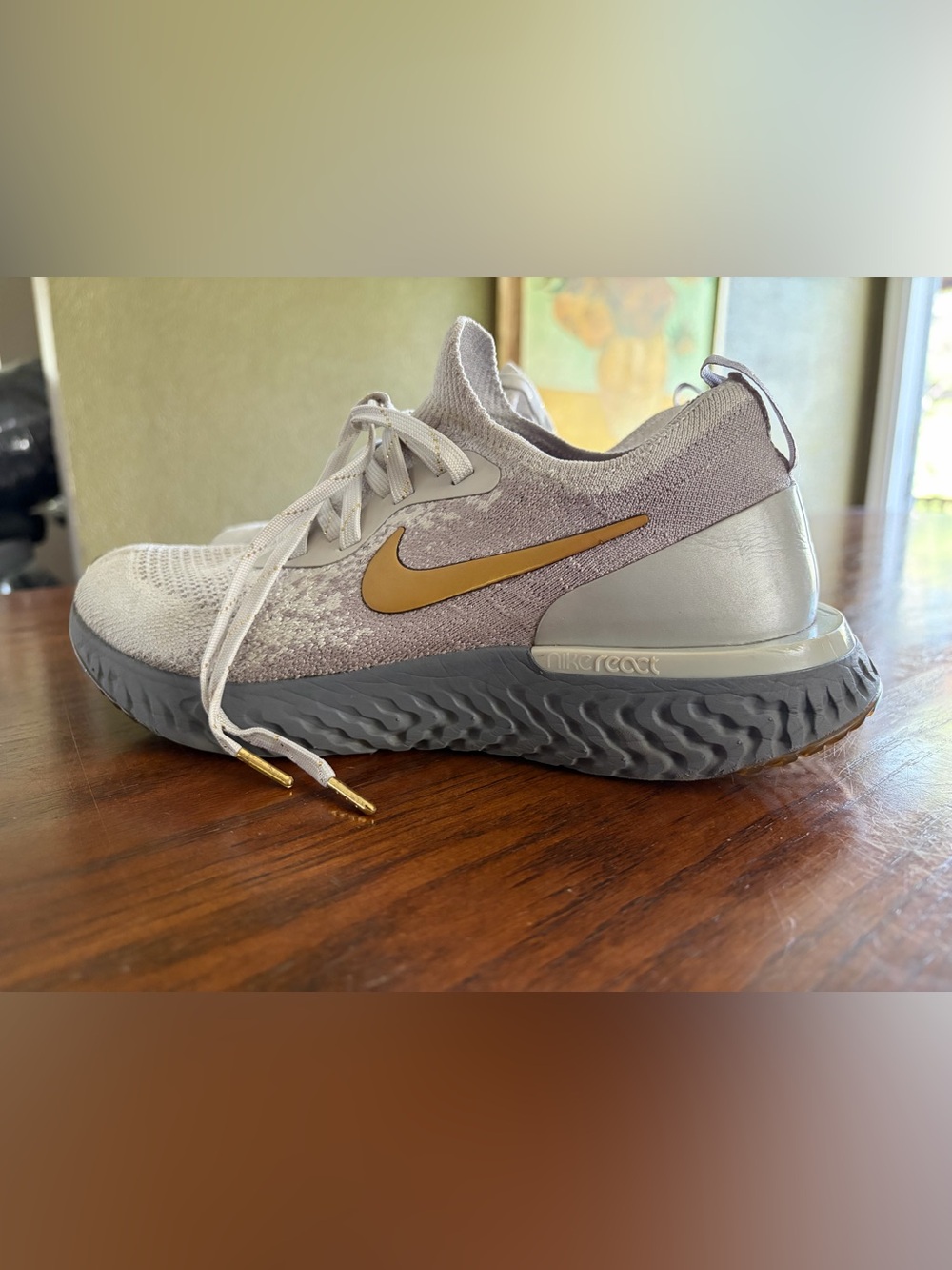 Nike Epic React Flyknit
Vast Grey Metallic Gold (Women's size 8)